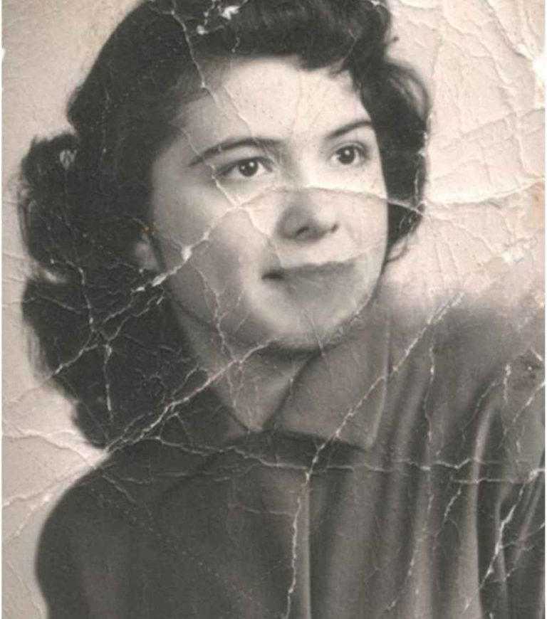 Damaged black and white photo of a woman